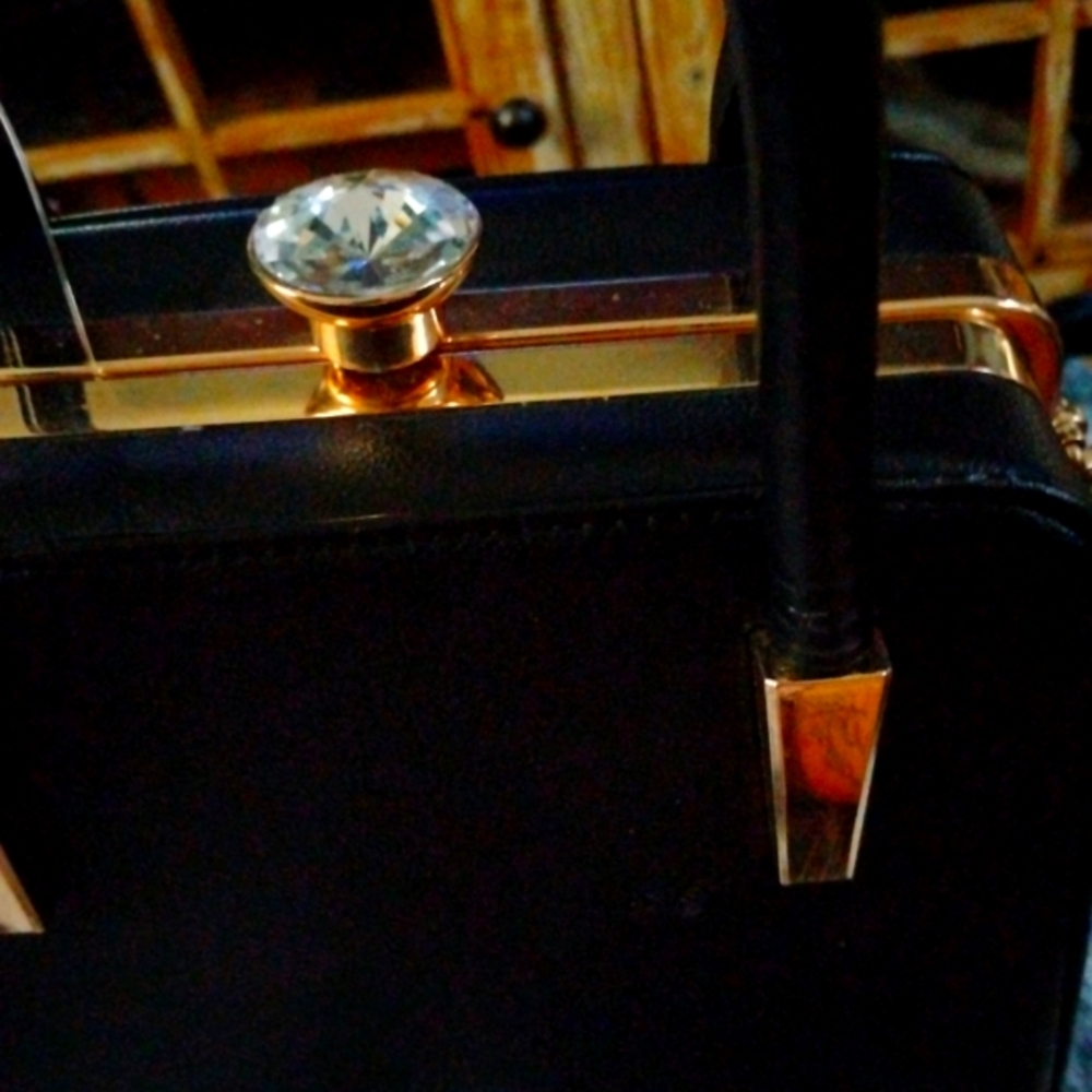 Elegant Black Handbag with Gold Accents